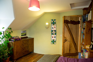 master bedroom in mud and wood house